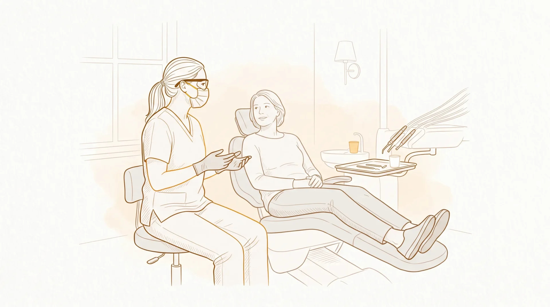 A dental professional in gloves, mask and protective eyewear speaks calmly with an adult patient seated in a chair beside a small tray.